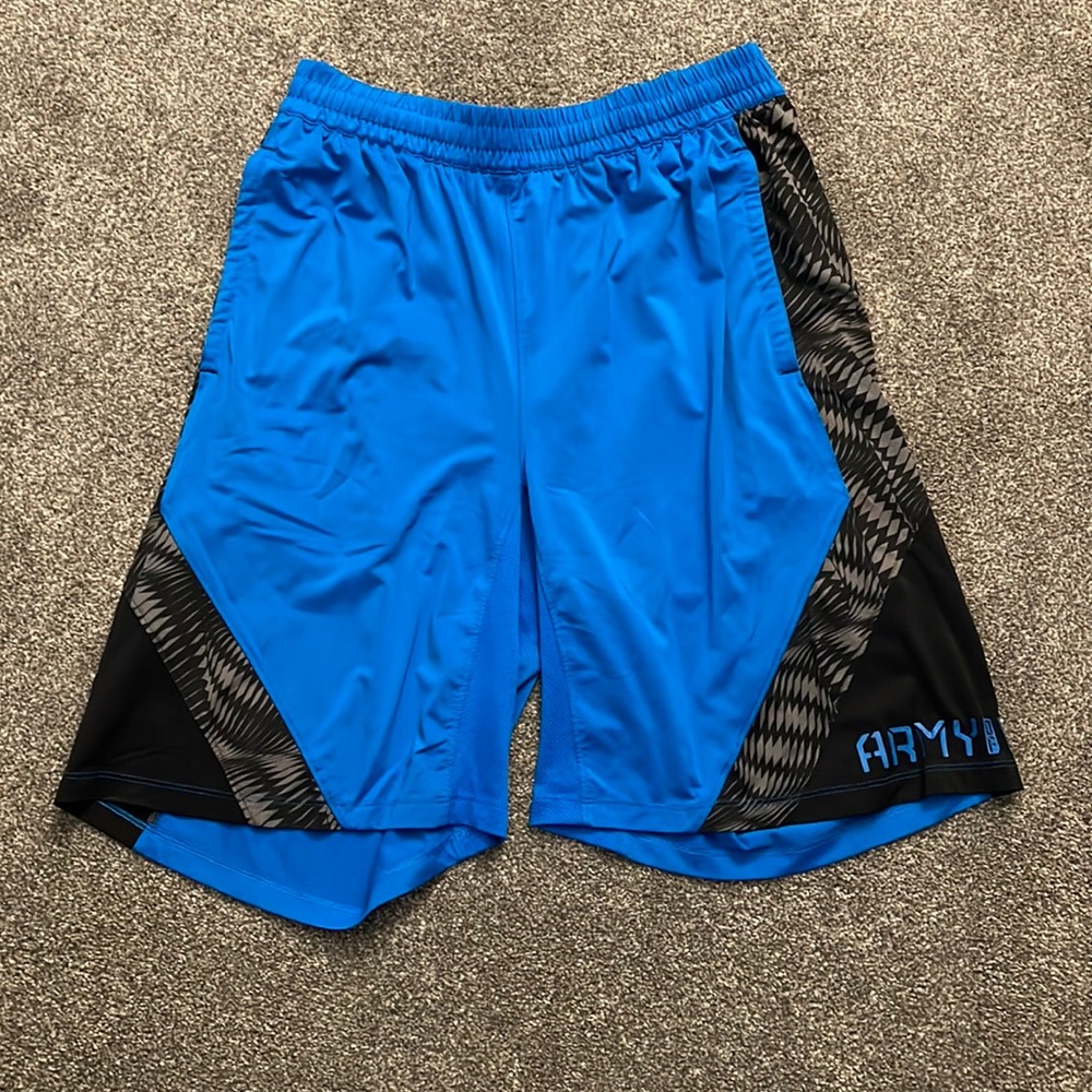 Under armor “army” size medium loose. 11 inches